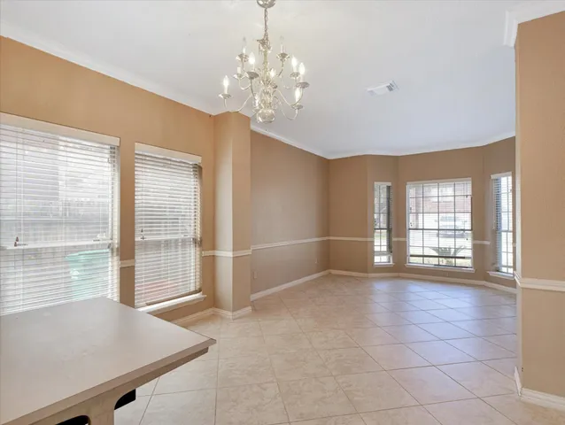 a view of a kitchen with a sink and dishwasher a kitchen island with wooden floor