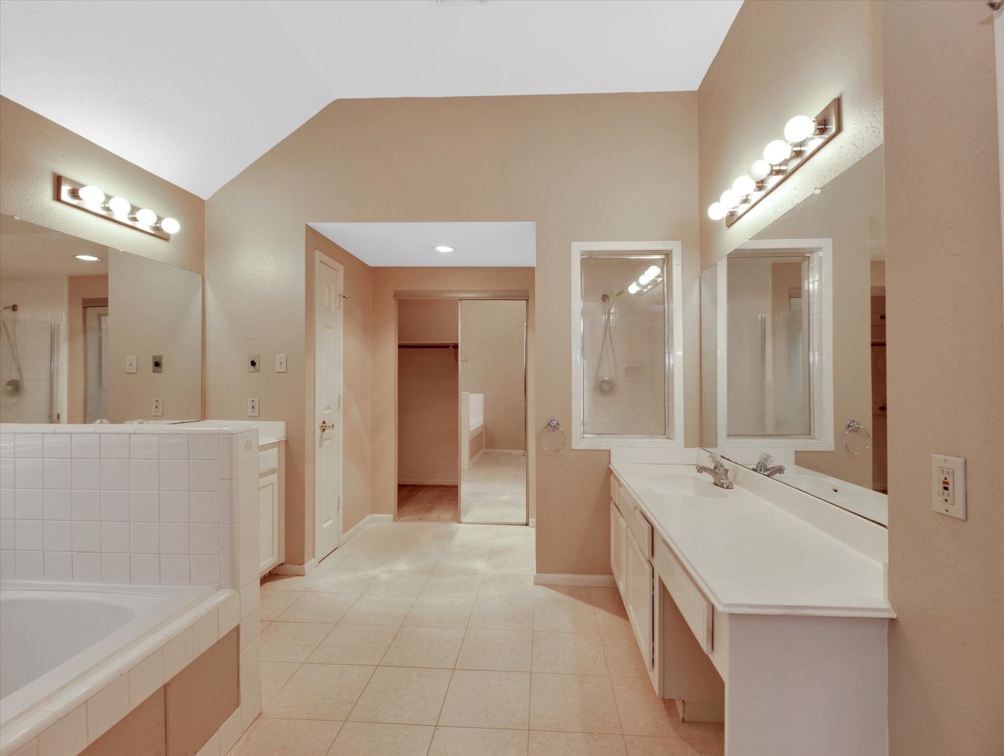 16423 Ash Point Lane Sugar Land, TX 77498 - Photo 29 of 46 a spacious bathroom with a bathtub sink and mirror