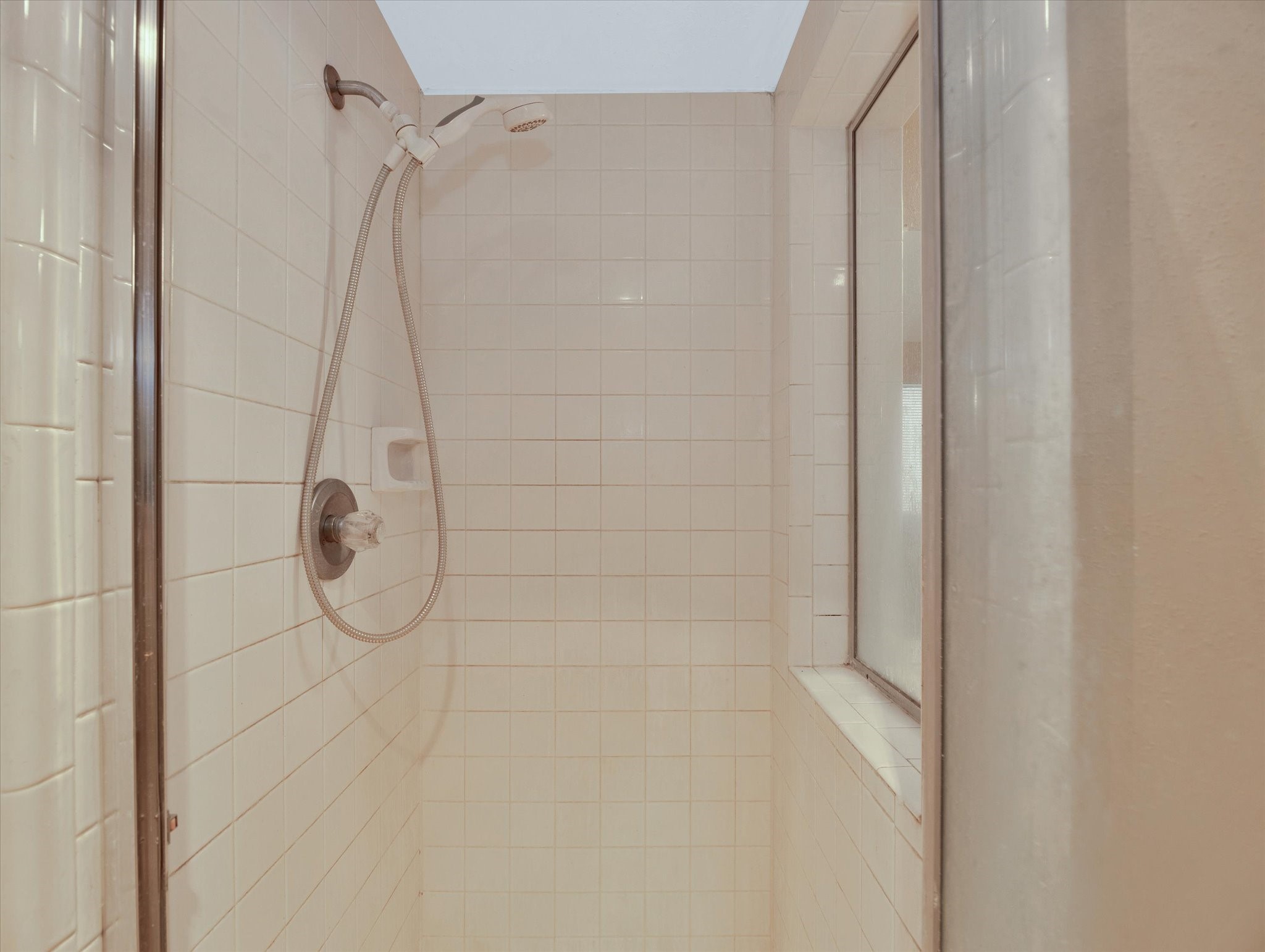 16423 Ash Point Lane Sugar Land, TX 77498 - Photo 31 of 46 a bathroom with a glass shower door