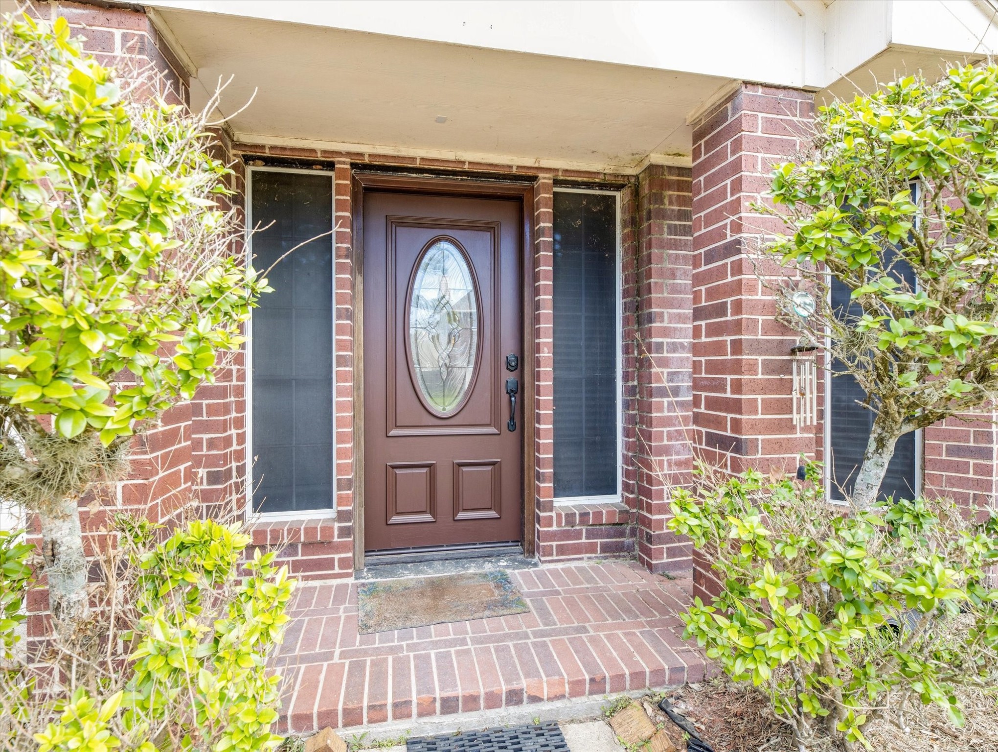 16423 Ash Point Lane Sugar Land, TX 77498 - Photo 4 of 46 a wooden door with a clock on the wall