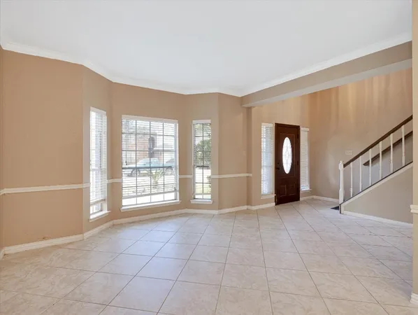 a view of an empty room and window