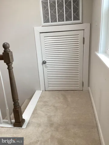 a view of a closet and a window