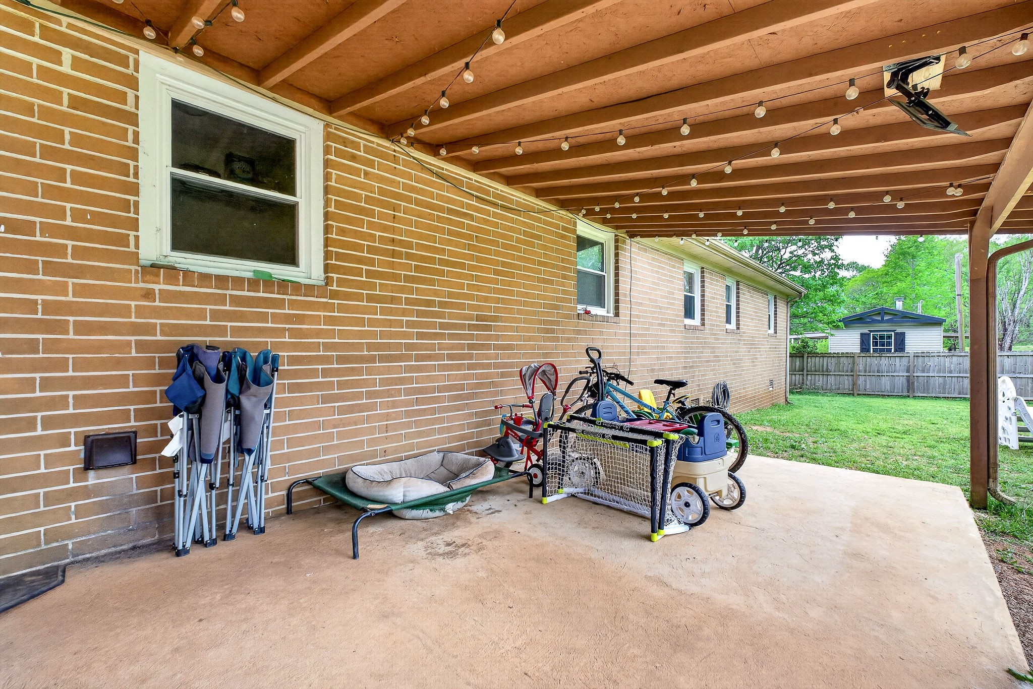237 Armstrong Road Doyle, TN 38559 - Photo 14 of 34 a backyard of a house with barbeque oven table and chairs