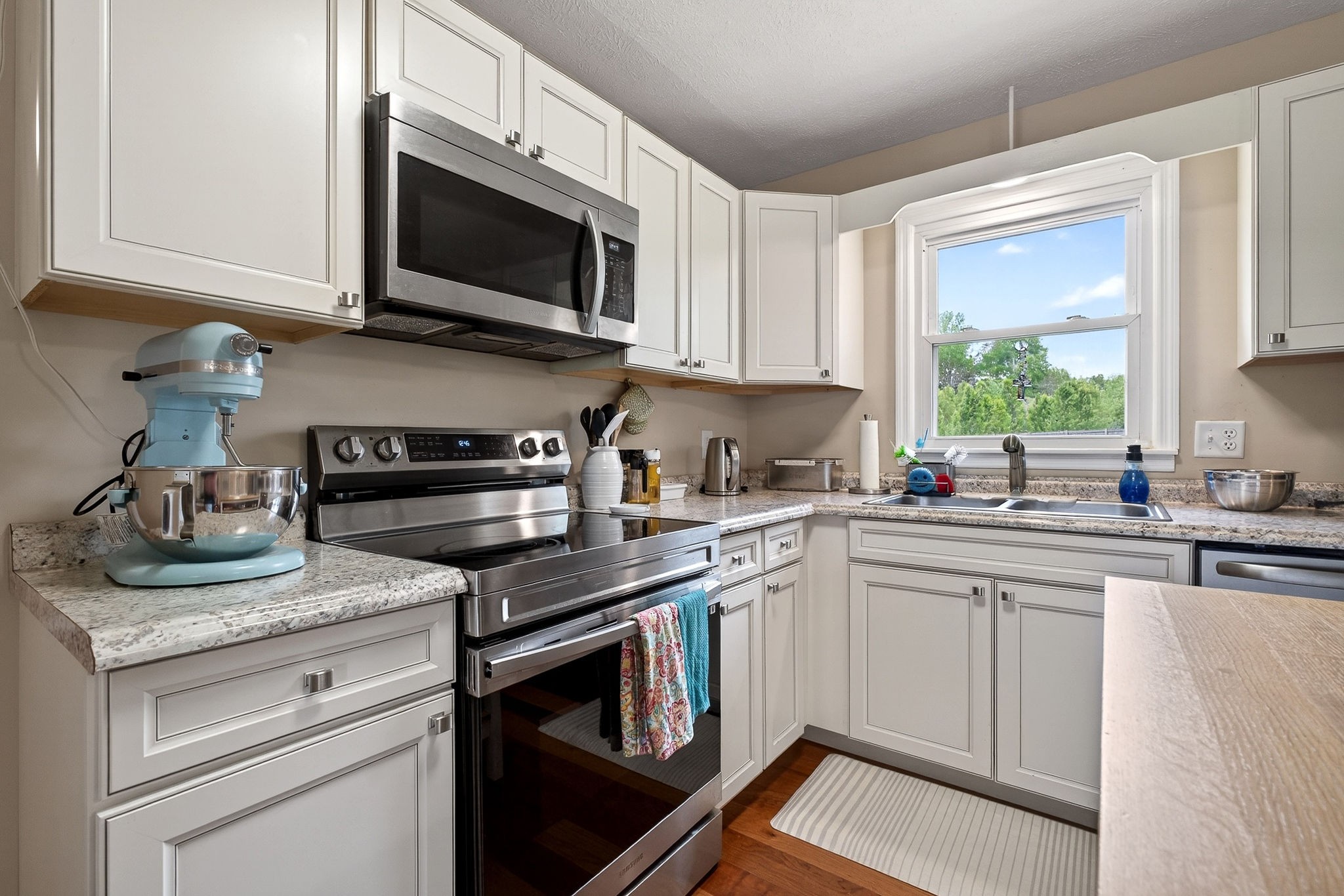 237 Armstrong Road Doyle, TN 38559 - Photo 7 of 34 a kitchen with cabinets stainless steel appliances a sink and a window