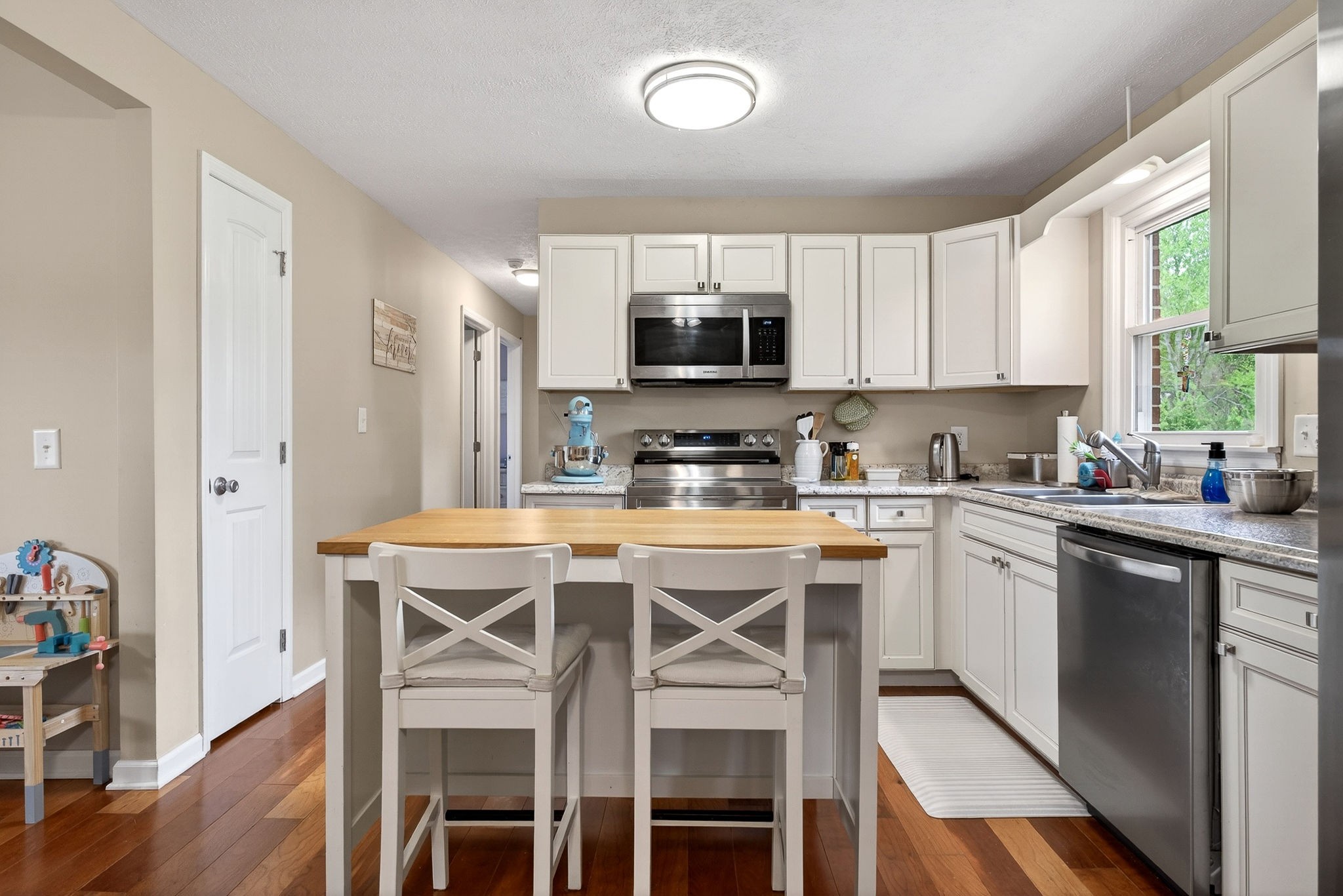 237 Armstrong Road Doyle, TN 38559 - Photo 8 of 34 a kitchen with a table chairs microwave and cabinets