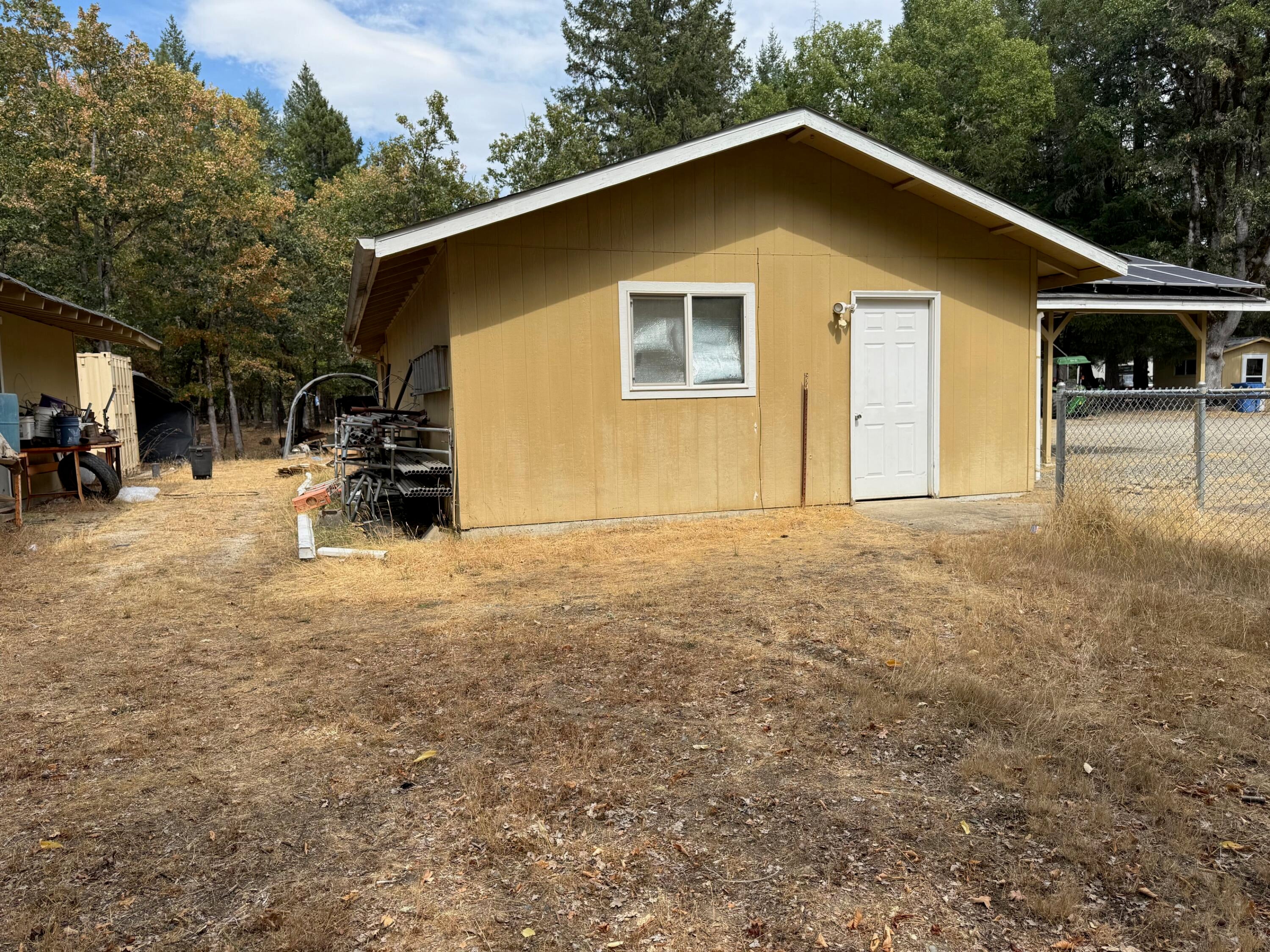 1800 Dick George Road Cave Junction, OR 97523 - Photo 21 of 37 end of gar- shop see solar panels on car