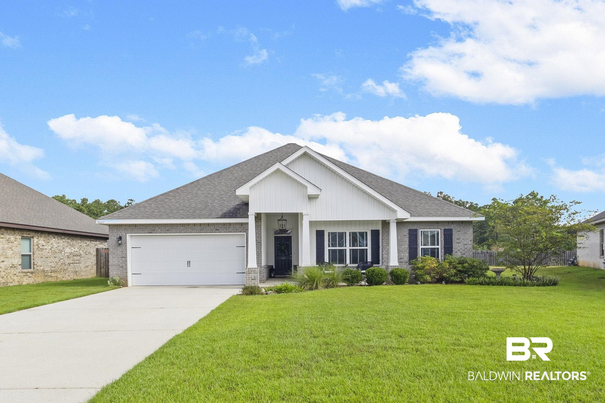 31663 Kestrel Loop Daphne, AL 36527 - Photo 2 of 86 View of front facade with a garage and a front yard