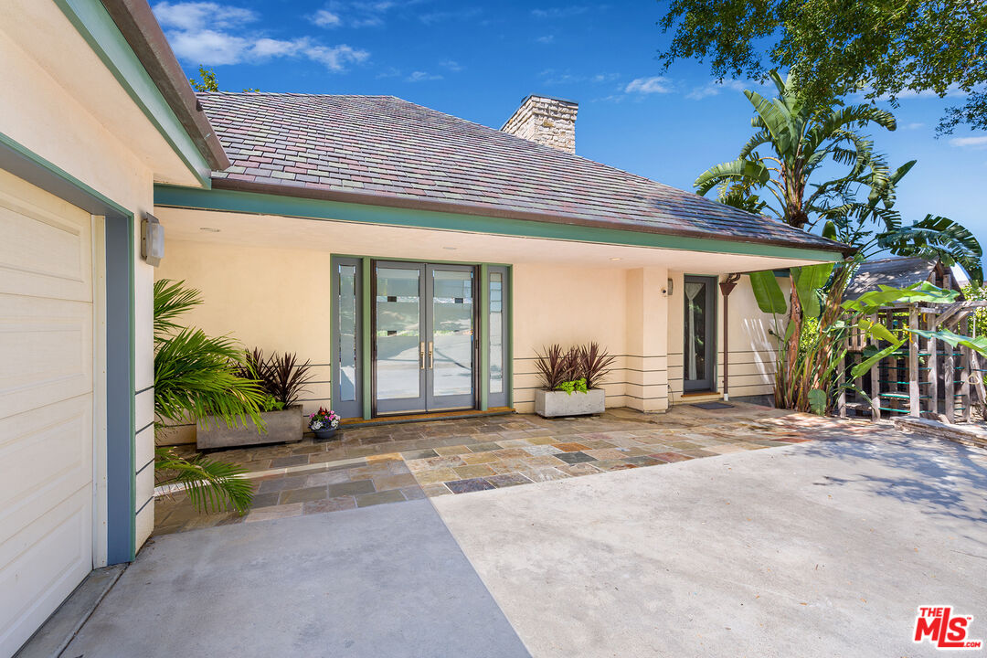 26227 Fairside Road Malibu, CA 90265 - Photo 8 of 30 a view of a house with a patio