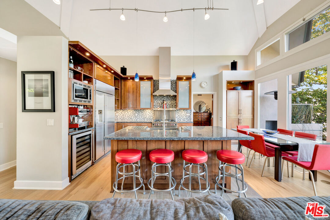 26227 Fairside Road Malibu, CA 90265 - Photo 10 of 30 a dinning table and chairs in a room