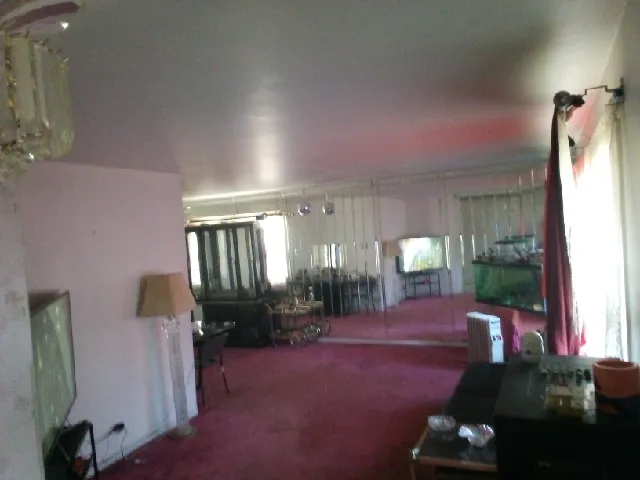 a lobby with furniture and floor to ceiling window