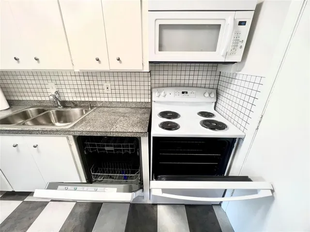 a bathroom with a sink and a stove