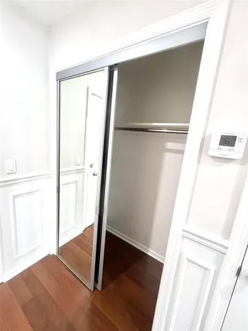 a view of front door with wooden floor