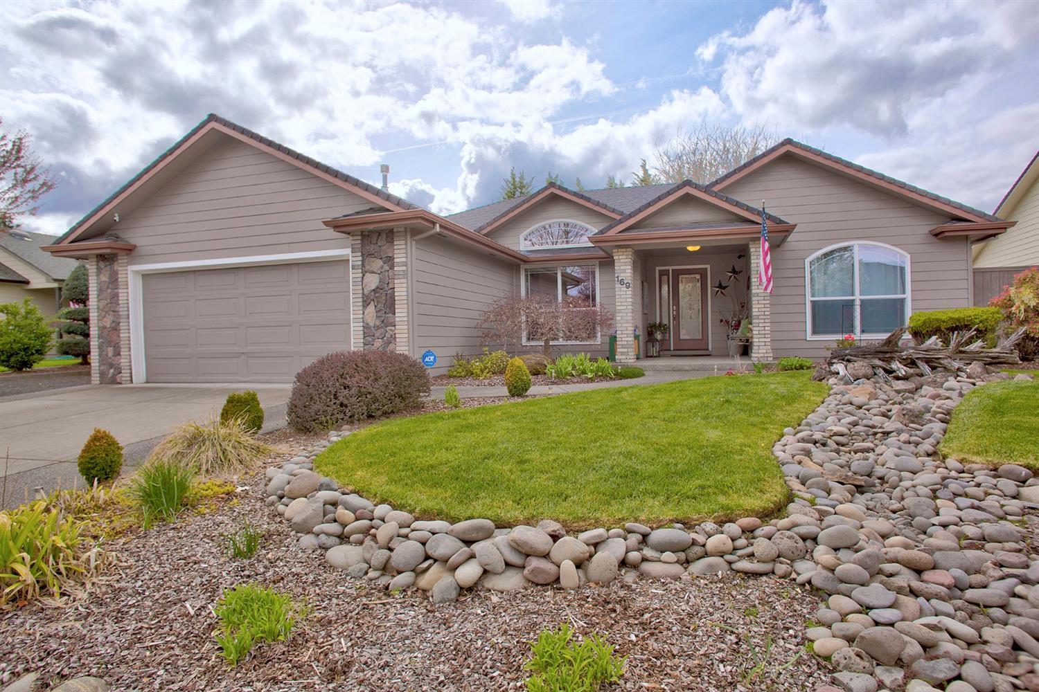 169 Orchardview Avenue Central Point, OR 97502 - Photo 2 of 28 a front view of a house with a garden