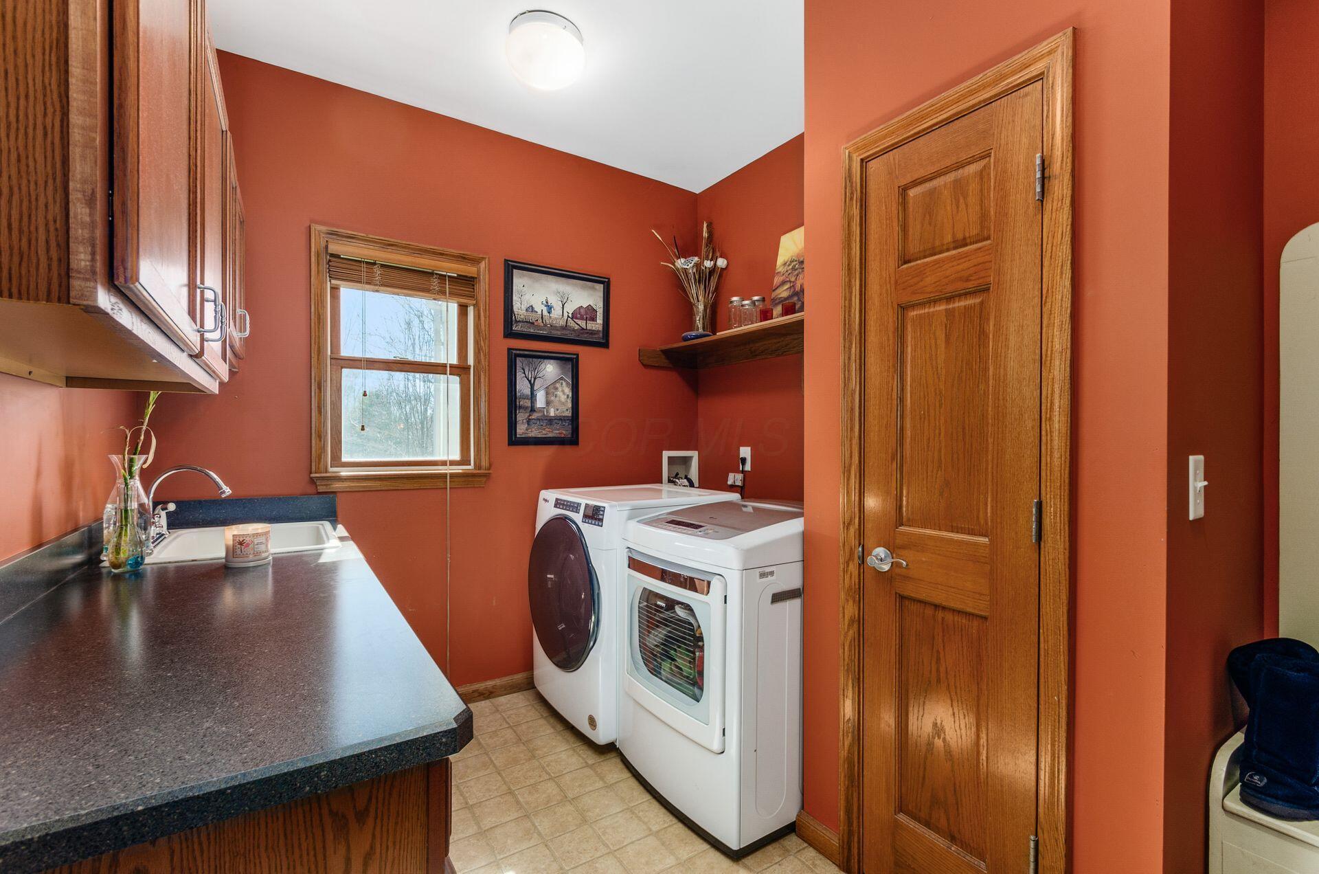 3680 Warrensburg Road Delaware, OH 43015 - Photo 19 of 46 Laundry with cabinets and closet