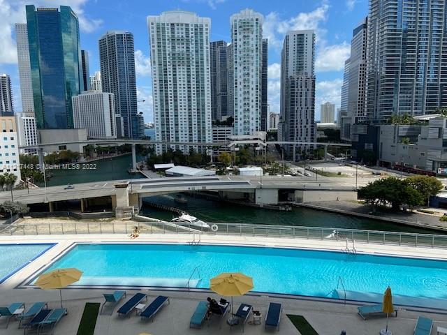 92 Southwest 3rd Street, Unit 1412 Miami, FL 33130 - Photo 17 of 37 a view of swimming pool with outdoor seating