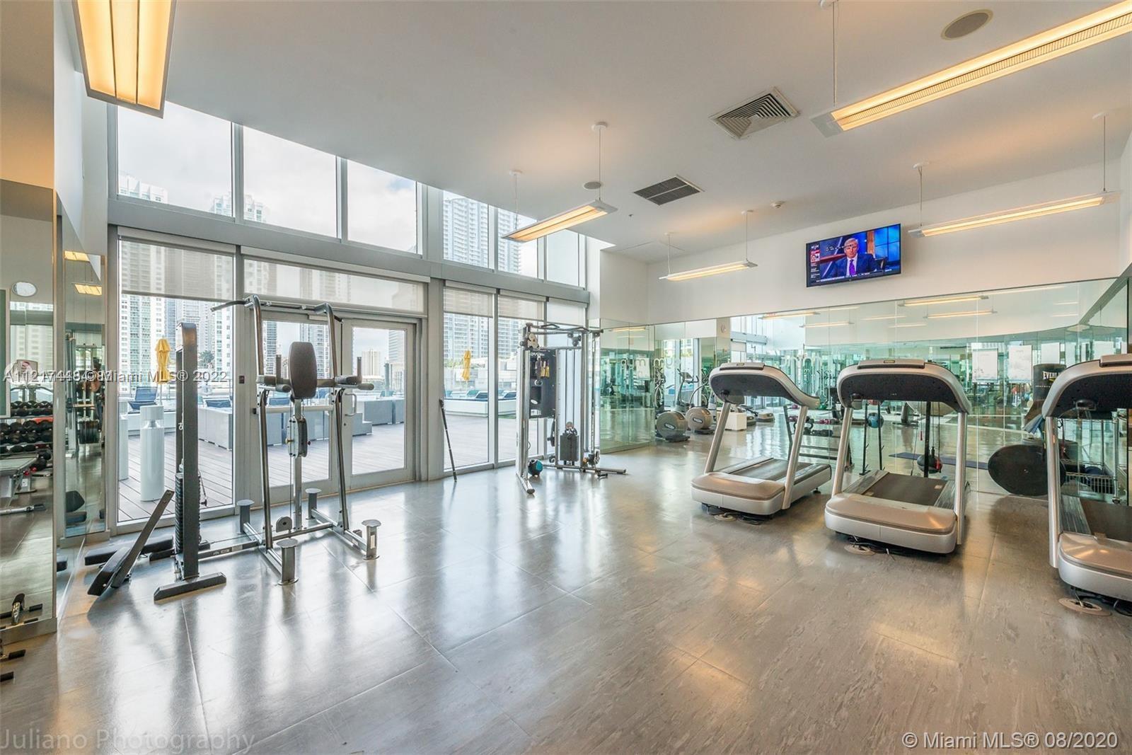 92 Southwest 3rd Street, Unit 1412 Miami, FL 33130 - Photo 18 of 37 a lobby with furniture and floor to ceiling window