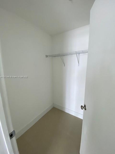 92 Southwest 3rd Street, Unit 1412 Miami, FL 33130 - Photo 10 of 37 a view of a room with racks on the wall