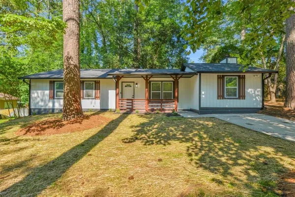 front view of a house with a yard
