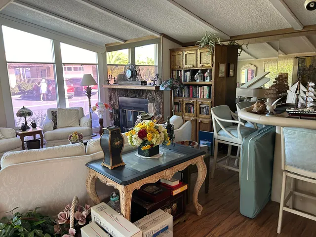 a kitchen with a table chairs and appliances