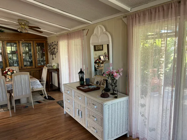 a view of a livingroom with furniture and a flat screen tv