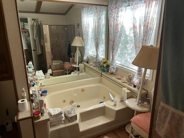 a bathroom with sink a mirror and a toilet