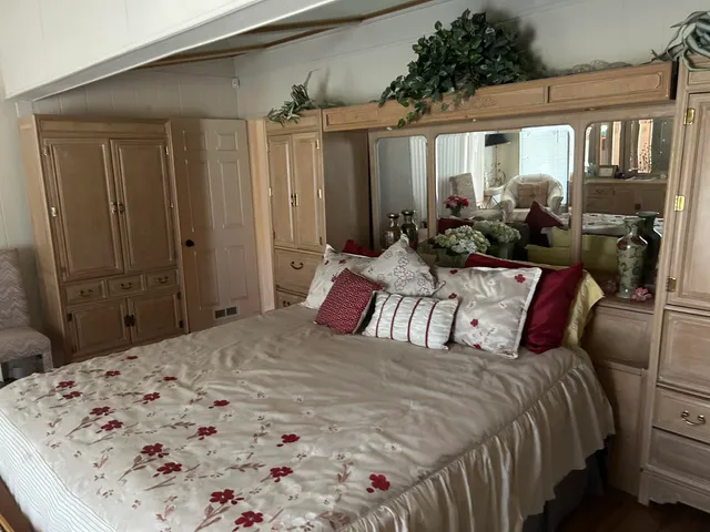 a bed room with a bed and furniture