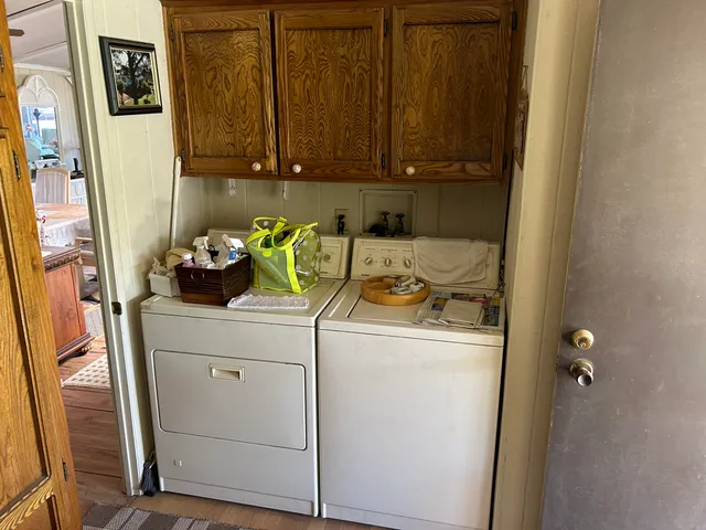 a kitchen with a sink a stove and cabinets