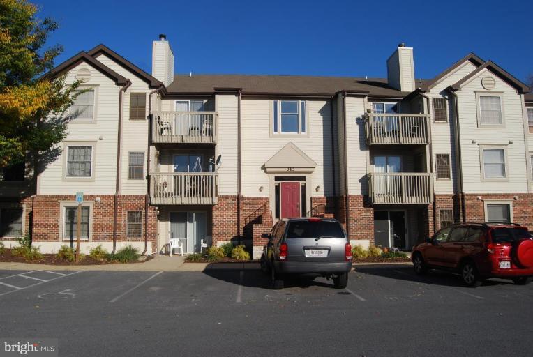 815 Stratford Way, Unit M Frederick, MD 21701 - Photo 1 of 3 a car parked in front of a white house