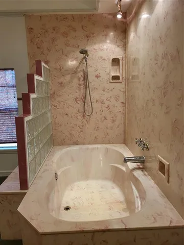 a bathroom with a bath tub