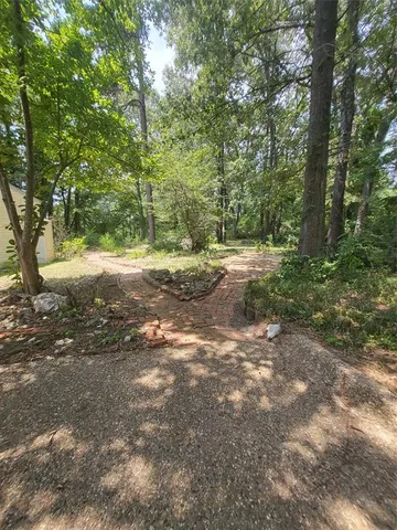 a view of a swimming pool with an outdoor space and seating area