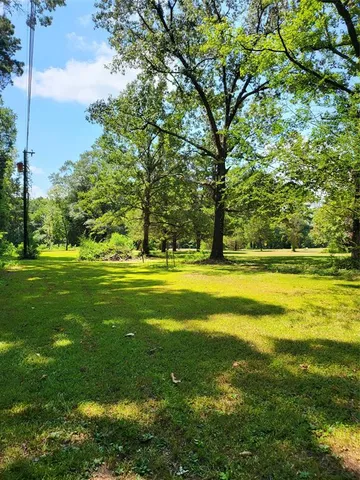 a view of a swimming pool with an outdoor space and seating area