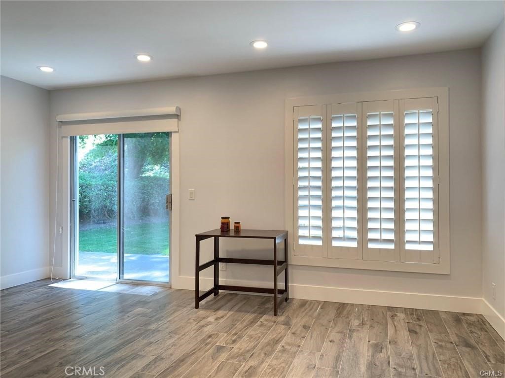 16264 Sierra Ridge Way Hacienda Heights, CA 91745 - Photo 9 of 14 an empty room with wooden floor and windows