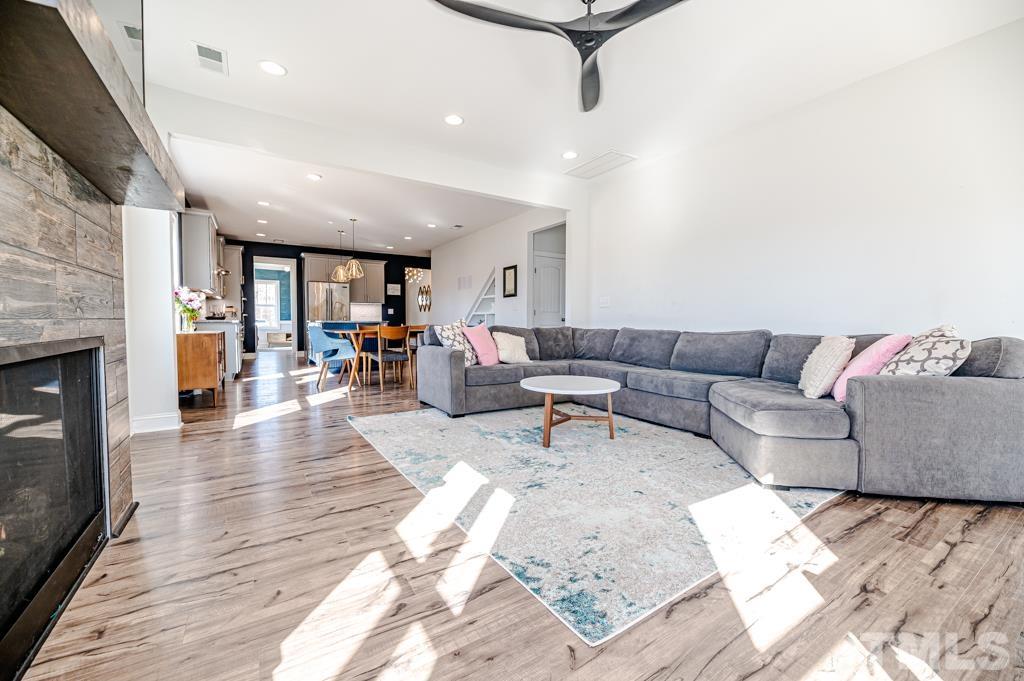 6712 Lucado Court Raleigh, NC 27603 - Photo 21 of 52 a living room with furniture and a fireplace