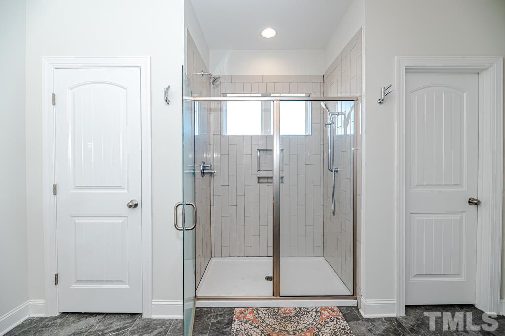 6712 Lucado Court Raleigh, NC 27603 - Photo 25 of 52 a bathroom with a shower