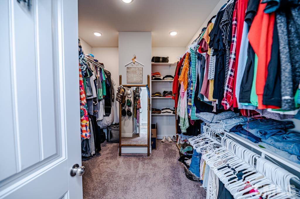 6712 Lucado Court Raleigh, NC 27603 - Photo 27 of 52 a view of walk in closet with clothes
