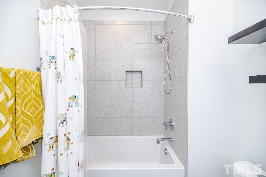 6712 Lucado Court Raleigh, NC 27603 - Photo 33 of 52 a bathroom with a bathtub