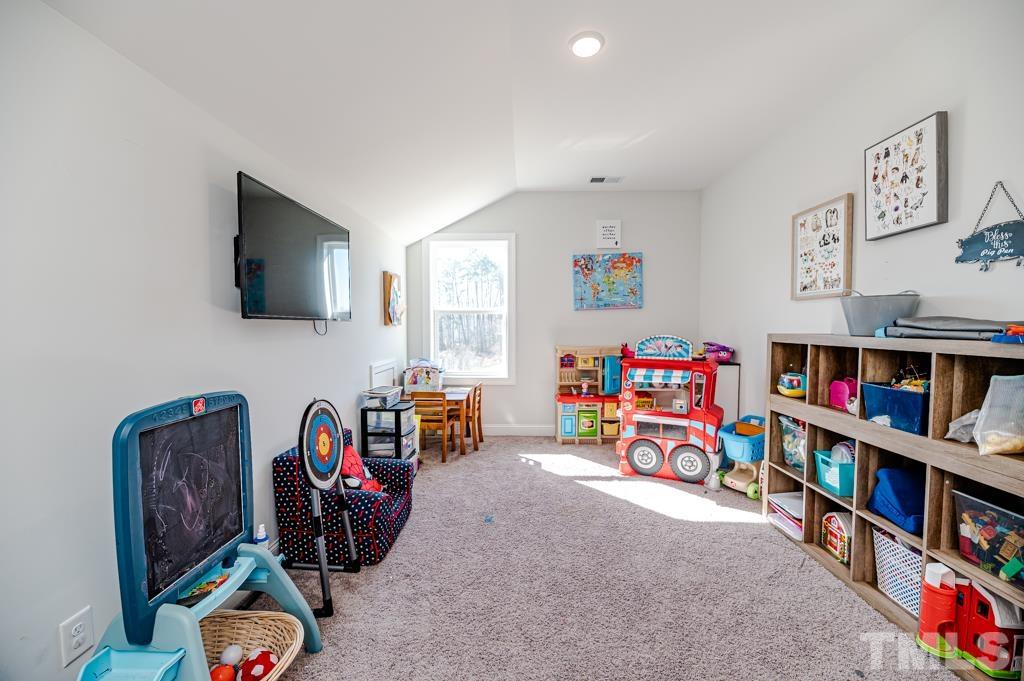 6712 Lucado Court Raleigh, NC 27603 - Photo 36 of 52 a view of a workspace with furniture and toys