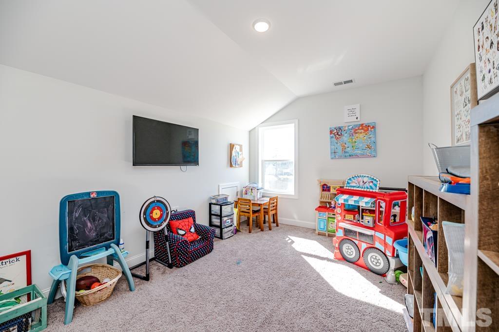 6712 Lucado Court Raleigh, NC 27603 - Photo 37 of 52 a view of a livingroom with toys
