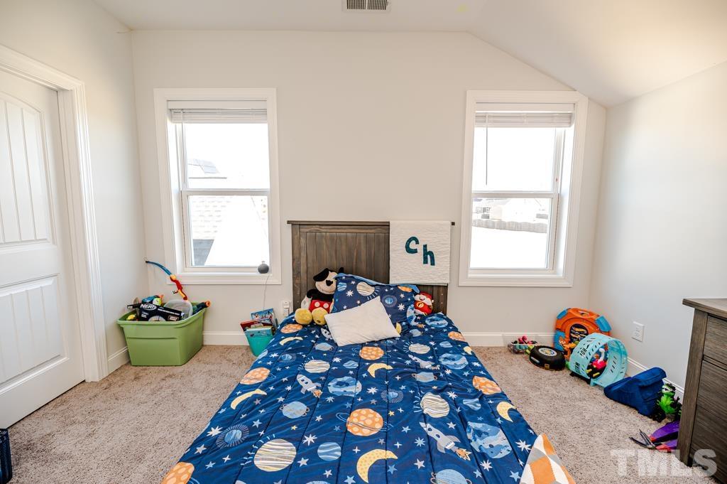 6712 Lucado Court Raleigh, NC 27603 - Photo 38 of 52 a room with furniture and a window