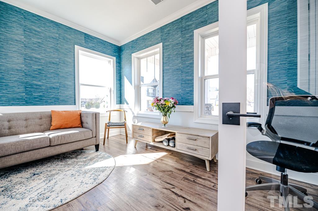 6712 Lucado Court Raleigh, NC 27603 - Photo 4 of 52 a living room with furniture and a large window