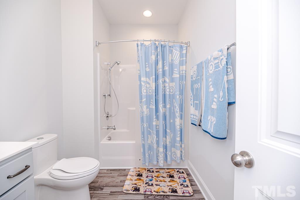 6712 Lucado Court Raleigh, NC 27603 - Photo 44 of 52 a bathroom with a toilet and a shower