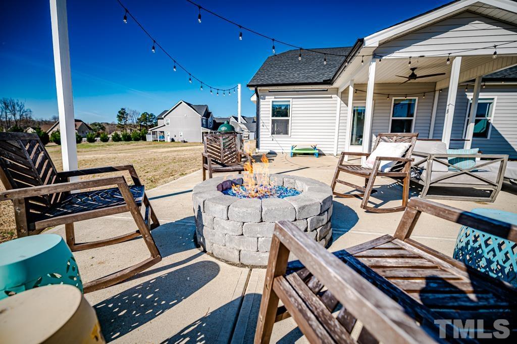 6712 Lucado Court Raleigh, NC 27603 - Photo 48 of 52 a view of a patio with couches chairs potted plants and wooden floor
