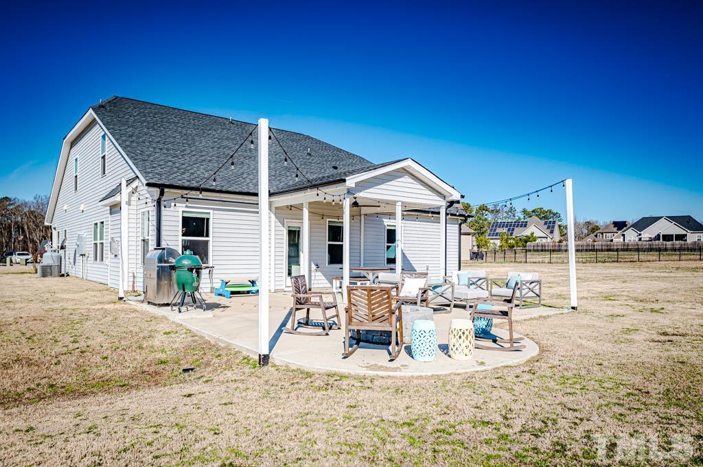 6712 Lucado Court Raleigh, NC 27603 - Photo 50 of 52 a view of a house with a patio