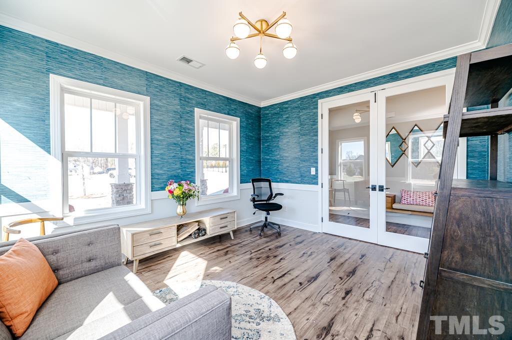 6712 Lucado Court Raleigh, NC 27603 - Photo 5 of 52 a living room with furniture and a large window
