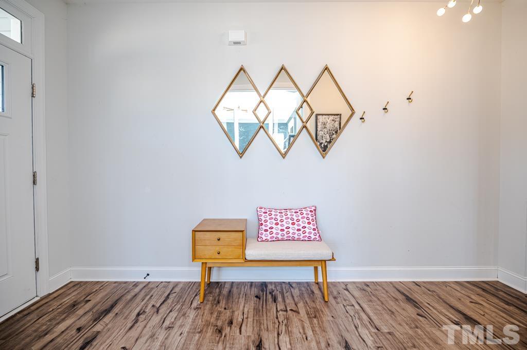 6712 Lucado Court Raleigh, NC 27603 - Photo 7 of 52 a view of a room with wooden floor and windows