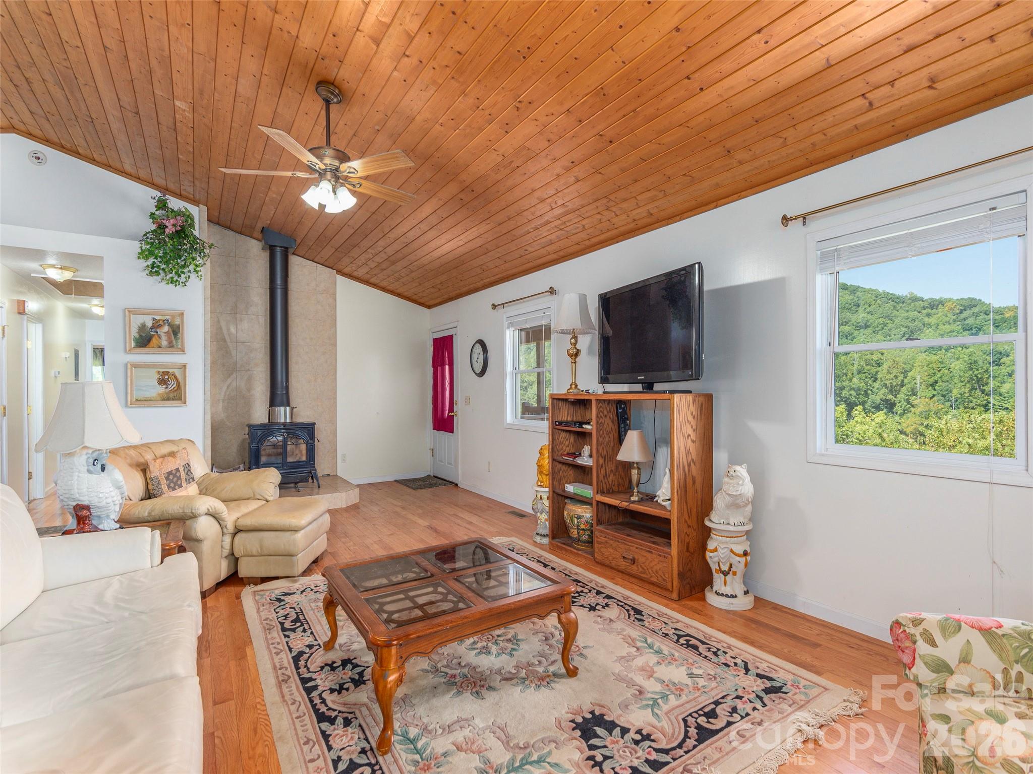 1120 Jacobs Branch Road Franklin, NC 28734 - Photo 8 of 36 a living room with furniture and a flat screen tv