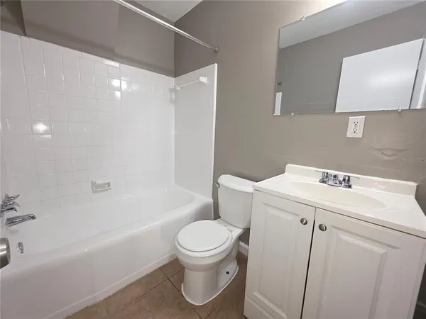 a bathroom with a sink toilet and bathtub