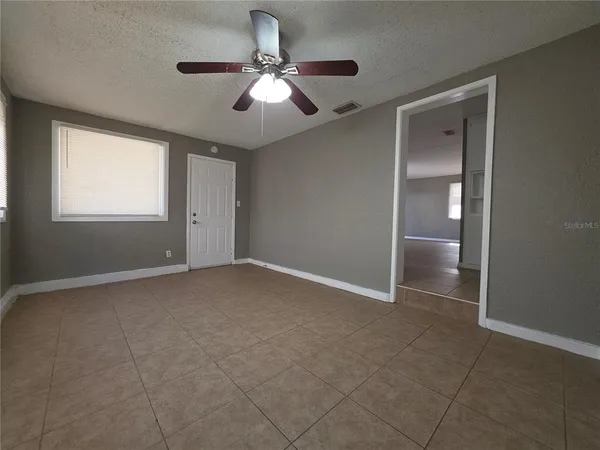 a view of an empty room with a window