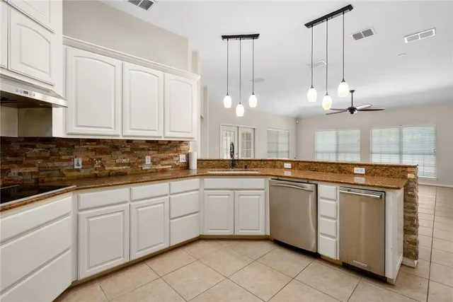 a large kitchen with cabinets