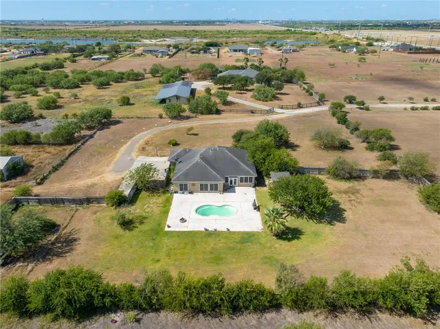 an aerial view of residential houses with outdoor space